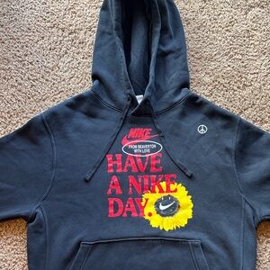 Nike Black Hoodie with Red Logo and Yellow Sunflower Graphic